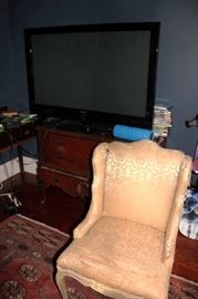Flat Screen and Side Chair and Wood Cabinet