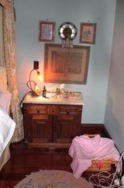 Marble Topped Night Stand with Lamps , Wall Sconce and Art