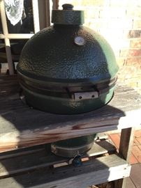 Big Green Egg cooker in wooden table