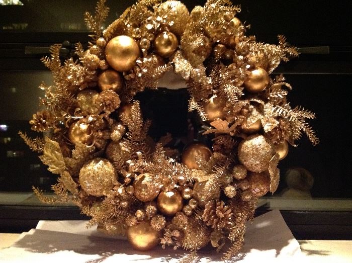 Shimmery gold gorgeous wreath. In very good condition. Diameter about 21". Has a hook on back for hanging.