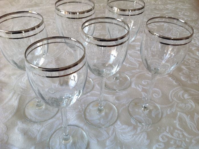 Set of six Italian wine glasses with silver rim. 