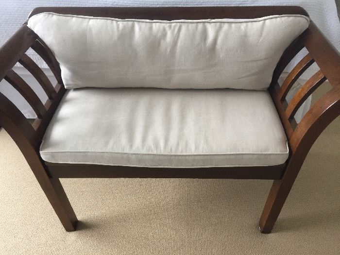 Rich and beautiful wood-framed matching love seat with neutral linen upholstered seat cushion. Linen is backed for upholstery grade use. Seat and back cushions have zippers on them for fabric cleaning and reupholstering. Wood and fabric are in excellent, clean condition. Width: 43". Height: 29". Seat height: 19".