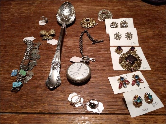 Sterling serving spoon, sterling charm bracelet, pocket watch (sprung), nicer costume jewelry