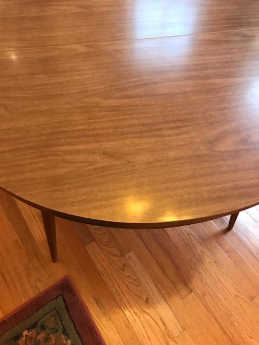 Top laminate surface of 48" round Mid-Century table.