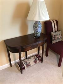 Fold out game table. Table lamp.