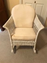 Beautiful, antique wicker rocker.