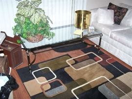 ONE OF THE AREA RUGS, GLASS-TOP COFFEE TABLE & MORE