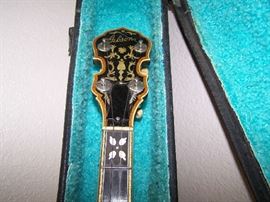 DETAIL OF THE M-O-P INLAY ON GIBSON BANJO