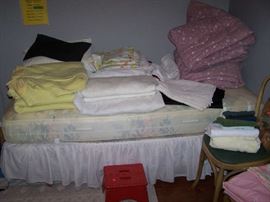 ONE OF THE TWIN BEDS & BEDDING
