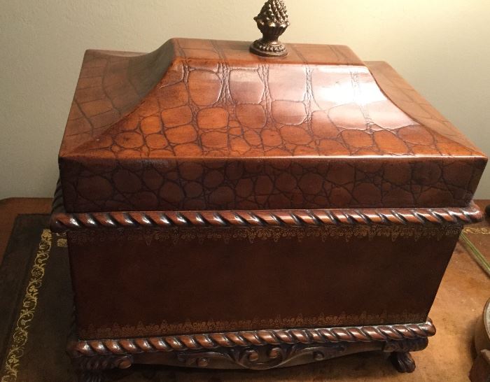 Wooden box with hinged lid, gilt design on body, faux animal print on lid, roped design, decorative base with 4 feet, brass finial 