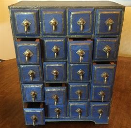 Small blue chest with 20 drawers, each with metal hardware &pull