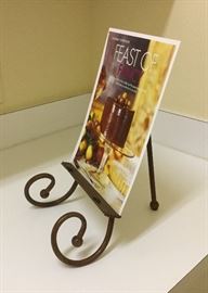 Cookbook or recipe holder, red and gold wash iron easel with front scroll legs and twisted rope accent on front