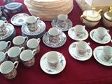 a charming collection of child-sized teacups and saucers