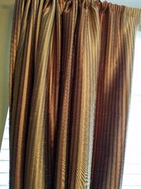 Beautiful silk curtains.  Silk from India.  Black out all light.  4 panels in brown, cream and rust stripe.  Approximately 10 feet long