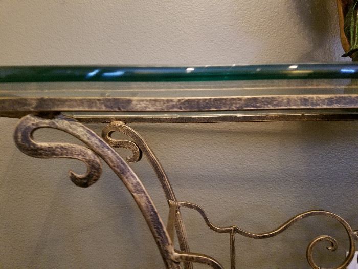 Glass entry/sofa table.  Wrought iron look with glass top.  57 x 16 x 31.  No maker