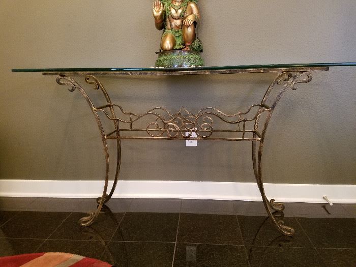 Glass entry/sofa table.  Wrought iron look with glass top.  57 x 16 x 31.  No maker