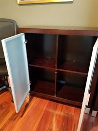 Smaller storage cabinet.  .  Purchased at Area 51 in Cap Hill.  Solid wood with two tempered glass doors.    Adjustable shelves.  14' x 30" x 40".  