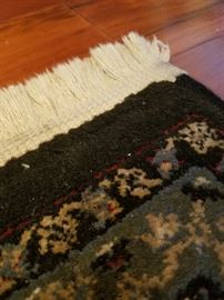 Wool rug.  Purchased at Sears in 2010.  64" x 90" without fringe.  