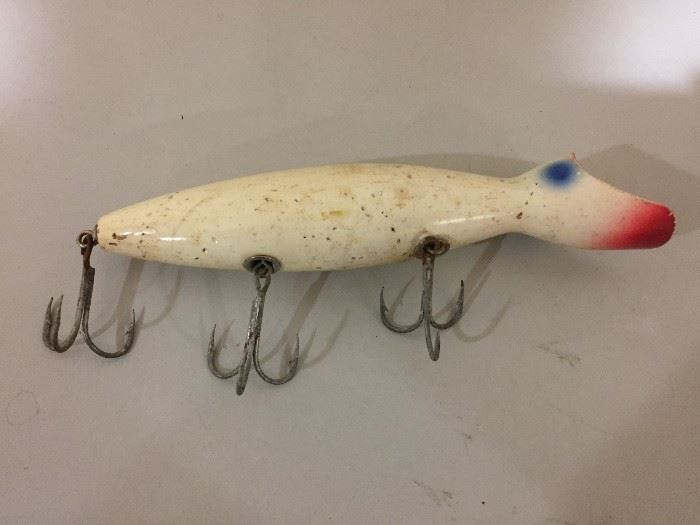 Vintage fishing lure with 9 hooks.
