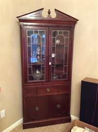Federal style wooden corner cabinet. Glass doors, drawer and lower compartment doors. #corner #cabinet