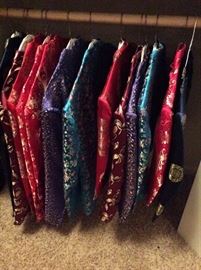 Asian Cheongsam silk jackets in women and child sizes. Gorgeous traditional fabrics, frog button closures.