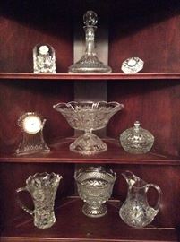 Waterford crystal decanter and clocks. Glass pedestal bowl. Crystal serving pitchers. Footed display bowl.