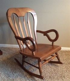 Unique mid century rocker with distinctive curved arms