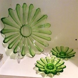 Green glass tray bowl hybrid with matching taper candlesticks. Attributed to Blenko.