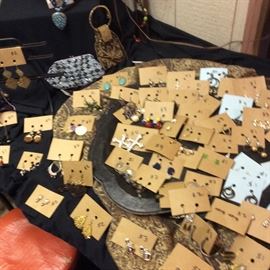 Earrings in multiple styles, from estate to fashion forward current looks. Ear syles are pierced, French / Eurowire, clip and screw. Finish options include gold silver, antiqued and many other varieties. Beaded evening handbags. 