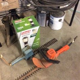 Hedge trimmers, new propane powered Coleman lantern, jack stands, hoses. Brass spigots, water sprinklers. Fleckstone paint.