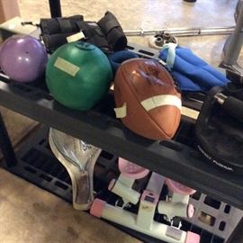 Footballs, stair stepper, fitness balls, ankle weights, racquetball racket. Gaiam yoga ball and blocks. Bodyrev pushup grips