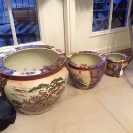 Matching graduated nesting koi fish bowls in opulent Oriental themes.