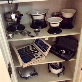 Fondue makers, which double as buffet warming pots when you supply your own canned fuel.  Vintage Sheffield Golden Prestige cutlery carving set. Hamilton Beach mixer frother and blender. Retro Rival Crock-pot, Oster brand panini press.  
