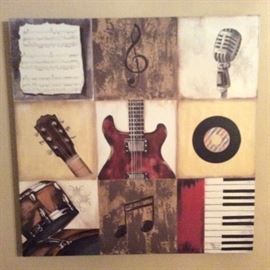 Music themed wall decor shows piano, guitar, drums, microphone, sheet music.