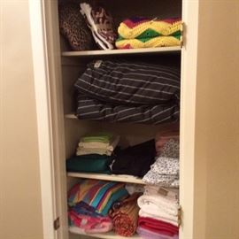 Linens include sheets, hand towels,  towels, comforters, pillows and chevron crochet throw.