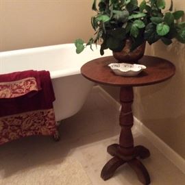 Wood pedestal table. Dish. Potted ivy.