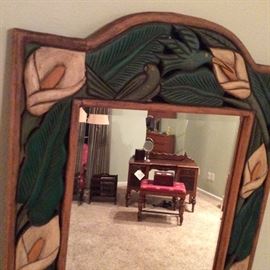 Beveled mirror with derailed carved wood frame