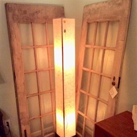 Vintage pair of French doors including original metal hardware. Noguchi style floor lamp.