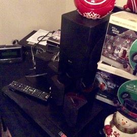 Samsung surround sound speakers and LG Blu-ray player. Laser landscaping lights. Snowman cookie jar.