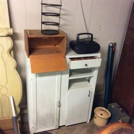 Whitewash cabinet has doors and drawers and a specialty drawer with slotted square sections for organization. Pulled from an old home place, the wall piece requires stabilization. Wood bread box. Full size bed footboard and side rails.