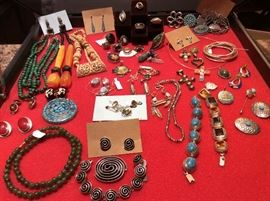 Turquoise inlaid bracelets in silver. Natural carved bon necklace. Semi precious beads. Cross charms and pendants.