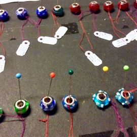 Multicolor Pandora type beads in Sterling Silver with delicate glass accents.