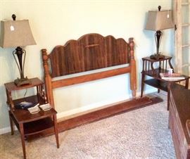 Pair of vintage wooden 2 tier tables. 3 way electric lamps have elongated urn bases. Full size headboard dates to the roaring 1920s and comes with original side rails.