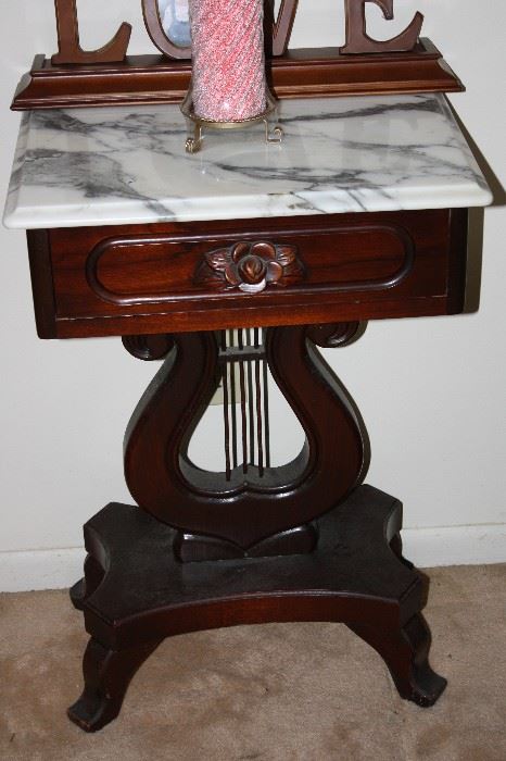 There is a pair of beautiful Marble Top  Lyre Tables