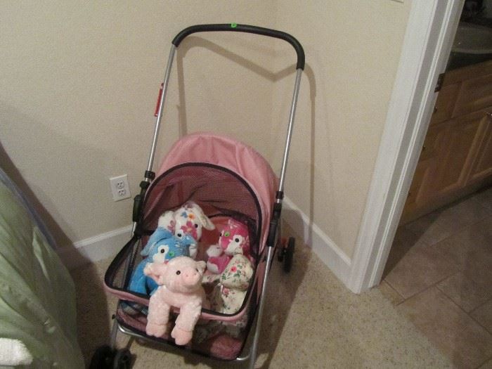 Plush animals and baby stroller.
