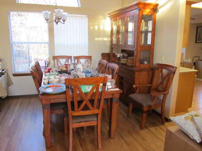 Mission style hutch and matching dinning table with 8 chairs and a extra leaf.
