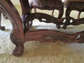 Heavy carving details on trestle base of table