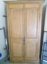 Large Armoire with loads of storage. Versatile piece, can go in any room. Size: 47" X 26" X 80"