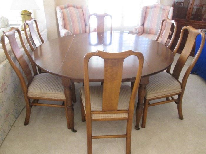 Unique Dining Room Table:  Subtle and classic Colonial style with 2 drop-leaf sides.  Also has 2 extra 22" leaves and pads.  Support system with gears accommodates extra leaves.  Sizes:  60" open/30" sides down/104" X 60" fully open with both leaves.    6-Chairs sold separately.  All in very good condition! 