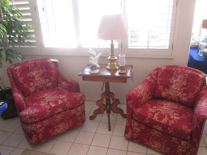 1-Swivel Rocker and 1-Occasional Chair upholstered in rich red fabric.  Antique Accent Table